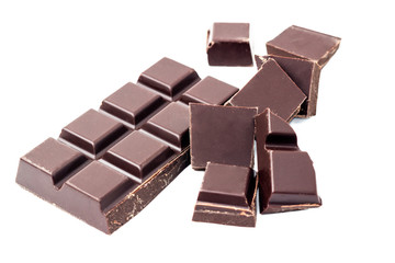 Chopped chocolate cubes, pieces of dark chocolate bar isolated on white background