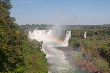 Rainbow in the Devil's Throat (Garganta del Diablo) of the Iguazu waterfalls, the largest in the world. Iguazu Falls located on the Iguazu River on the border of the Argentina,Brazil