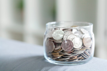 Business concept, saving planning with coins in glass jar