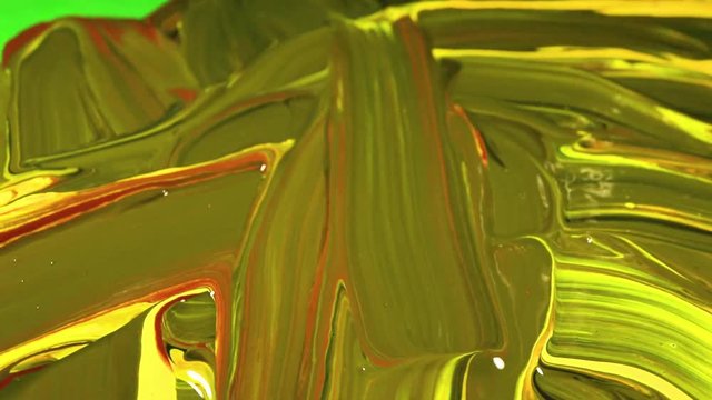 brush smears colored paint. A palette for mixing paints. Artist's tools: types paint with a brush. Artist dabs brush in a palette with paints and applies a smear on canvas.