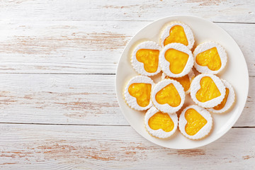 Heart shaped linzer cookies on a plate