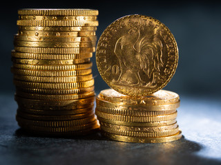 Gold coins over dark background