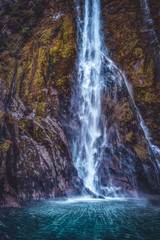 Fototapeta na wymiar Waterfall in Milford Sound in New Zealand