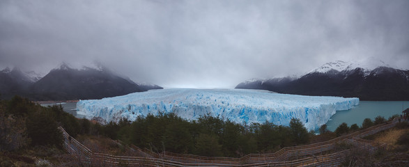 Panoramic view of glacier on cloudy day
