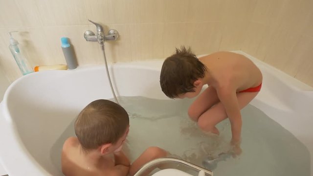 Concept of spa treatment. Concept of bath. Young woman enjoys in water with foam, takes care of her health and hygiene. Beautiful seminude girl. Mature body