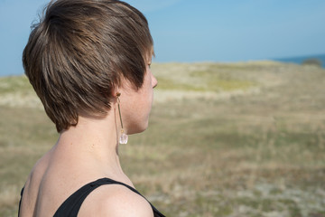Female portrait in profile, short hair