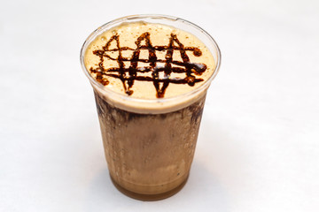 Unbranded coffee based ice drink with caramel and chocolate isolated on white background