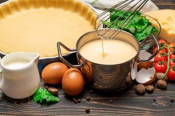 shortbread dough for baking quiche tart and ingredients in baking form