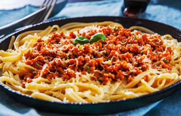 Traditional pasta spaghetti bolognese in a frying pan