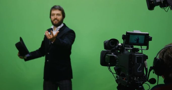 Slow motion shot of a cameraman recording an actor performing an intense scene