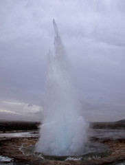 The eruption of the Strokkur geyser in the southwestern part of Iceland in a geothermal area near the river Hvitau