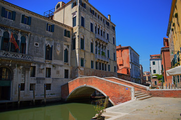 Fototapeta na wymiar Venice street view with small bridge in summer