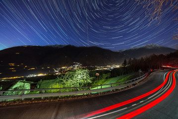 The car and star tails on the sky Motta, Italy.