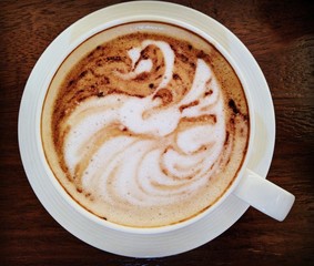 Silhouette of a swan in a coffee cup