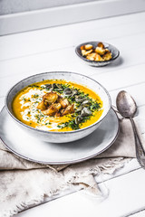 Pumpkin soup with cream,herbs and seeds