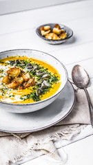 Pumpkin soup with cream,herbs and seeds