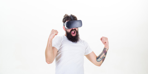 Obraz na płótnie Canvas Win virtual contest. Guy with head mounted display interact virtual reality. Hipster play virtual game. Virtual victory. Man bearded gamer VR glasses white background. Cyber reality game concept