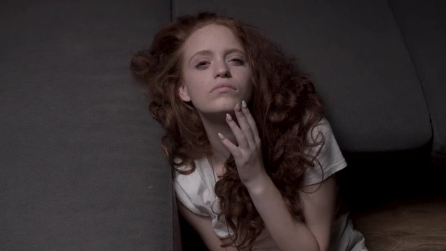 Drunk girl looking to the camera