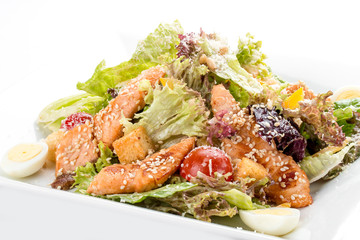 Caesar salad with chicken. On white background