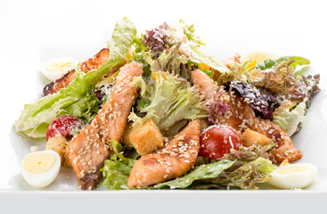 Caesar salad with chicken. On white background