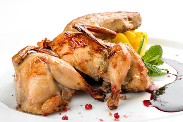 Quail with berry sauce. On white background
