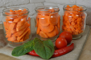 Sliced ​​carrots on a table in a jar