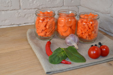 Sliced ​​carrots on a table in a jar