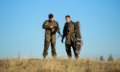Hunter friend enjoy leisure in field. Hunting with friends hobby leisure. Safety rules concept. Be...