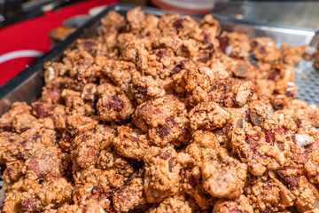 Fresh and delicious Taiwanese deep fried chicken (Salt crispy chicken) in Taiwan's night market, close up.