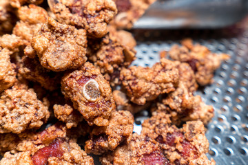 Fresh and delicious Taiwanese deep fried chicken (Salt crispy chicken) in Taiwan's night market, close up.