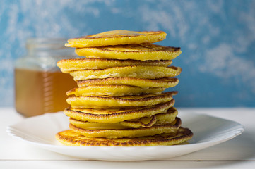 Stack of traditional russian pancakes blini on gray background with copy space. Homemade russian thin pancakes blini. Russian food, russian kitchen