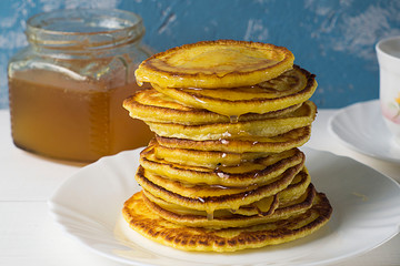 Stack of traditional russian pancakes blini on gray background with copy space. Homemade russian thin pancakes blini. Russian food, russian kitchen