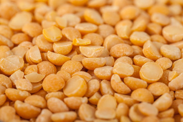 Yellow split mustard seeds for backgrounds or textures, healthy food