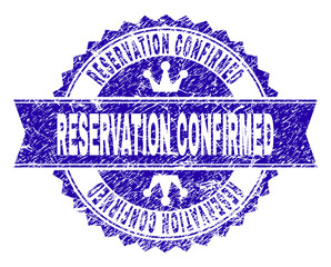 Obraz premium RESERVATION CONFIRMED rosette seal overlay with grunge texture. Designed with round rosette, ribbon and small crowns. Blue vector rubber watermark of RESERVATION CONFIRMED caption with grunge texture.