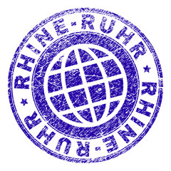 RHINE-RUHR stamp print with distress texture. Blue vector rubber seal print of RHINE-RUHR text with corroded texture. Seal has words placed by circle and globe symbol.