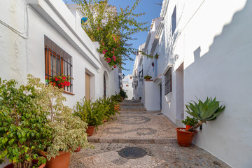Charming narrow historic streets of white village Frigiliana in Malaga province, Andalusia, Spain