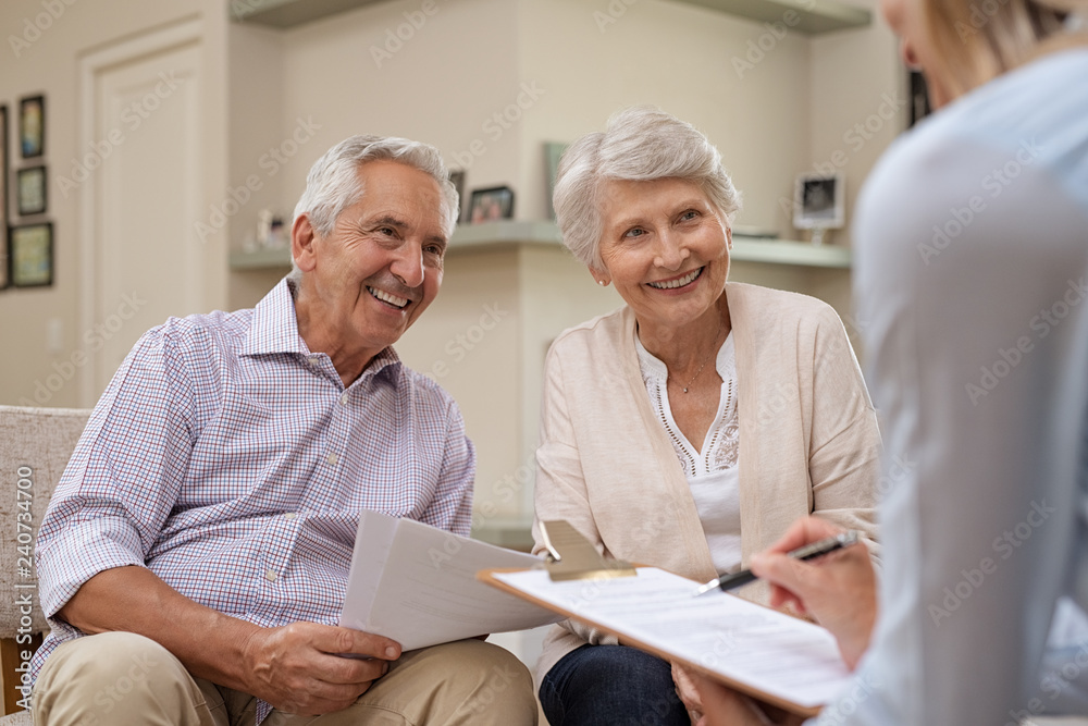 Wall mural senior couple meeting financial advisor