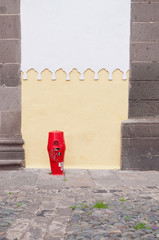 decorated wall and red water post