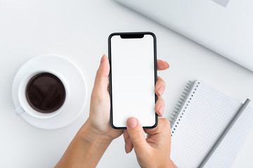 Woman holding device and touching blank screen