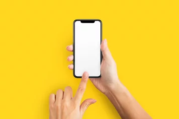 Foto op Plexiglas Mockup van vrouwelijke hand met mobiele telefoon met leeg scherm © Prostock-studio
