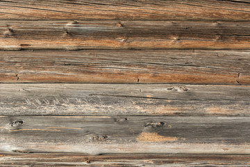 The wooden wall of the log house