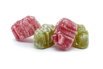 Four Delicious jelly babies Two Red and Two Green on a white background