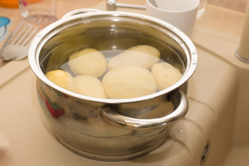 pan with water in which boiled potatoes