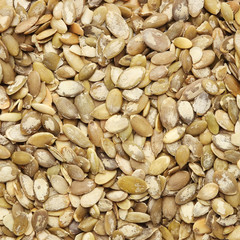 Raw pumpkin seeds for roasting closeup, top view