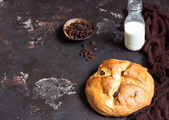 Round loaf of fresh homemade bread with raisin. Crisp. Traditional bakery concept. Rustic style. Copy space.
