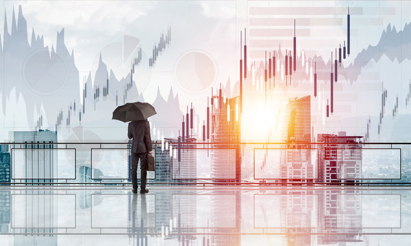 Elegant businessman standing with back and looking at modern business cityscape. Mixed media - Powered by Adobe