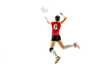 Female professional volleyball player isolated on white with ball. The athlete, exercise, action,...