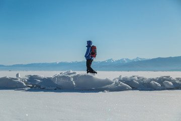 Man hiking on ice. Winter Landscape.