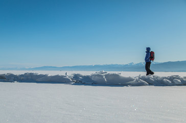 Fototapeta na wymiar Man hiking on ice. Winter Landscape.