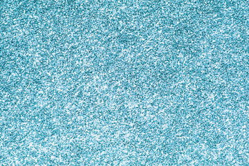 Shiny blue glittering confetti background.